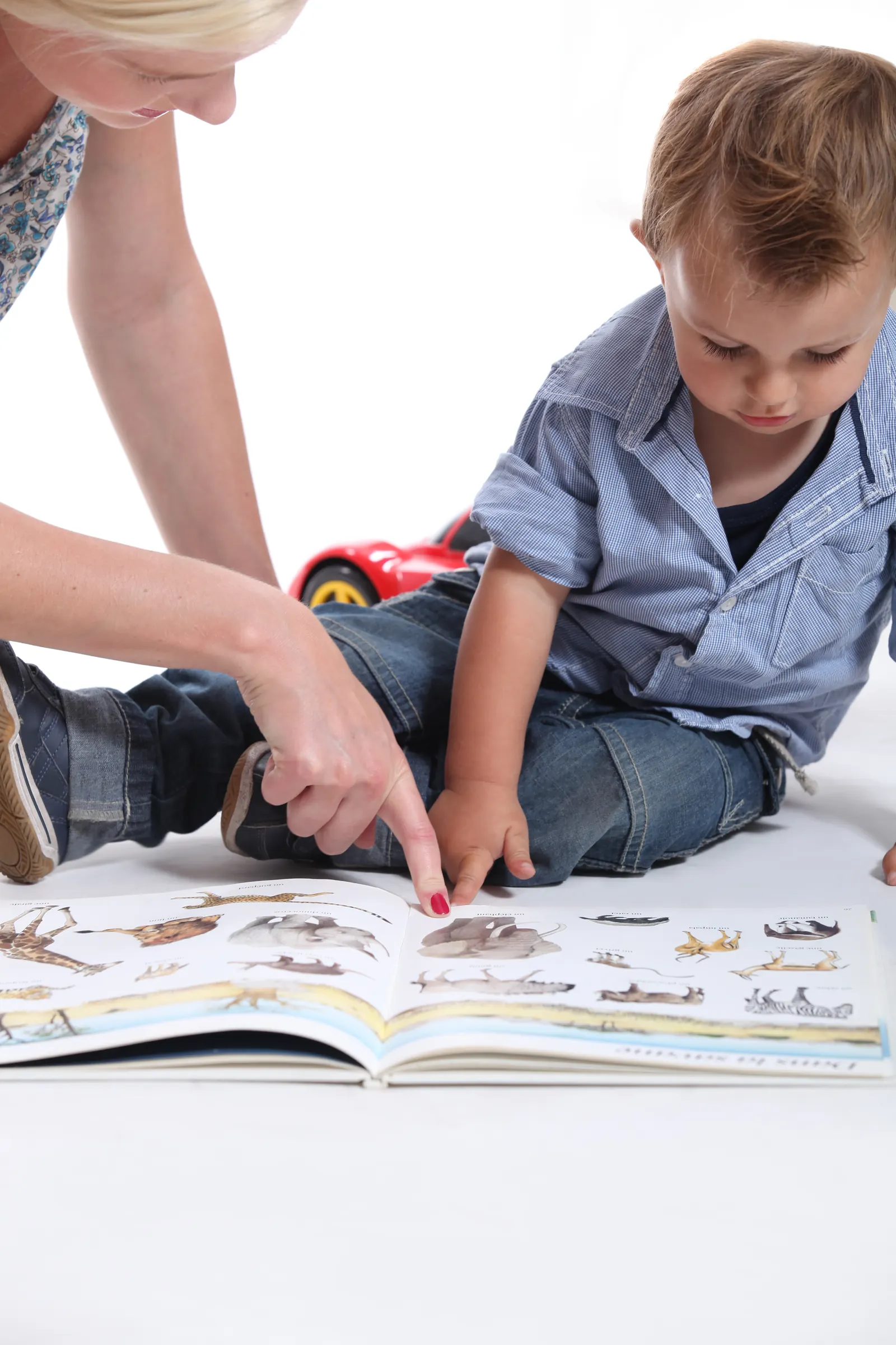 Mother,And,Child,Looking,At,A,Book at Grace Neighborhood Academy